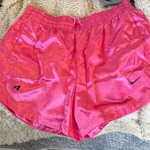 Pink satin Nike shorts.
Never worn
Size med